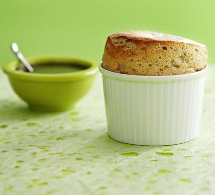 Pistachio soufflé with dark chocolate sauce