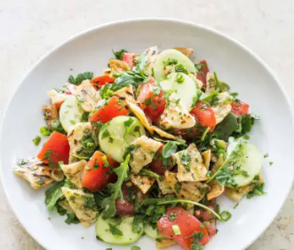Pita bread salad with tomatoes and cucumber (Fattoush)