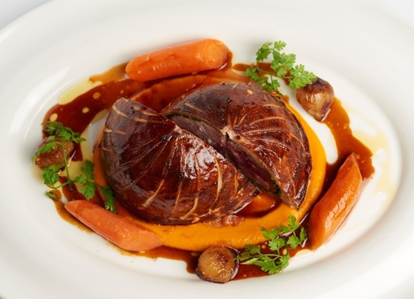 Pithivier of game with carrot purée and glazed onions