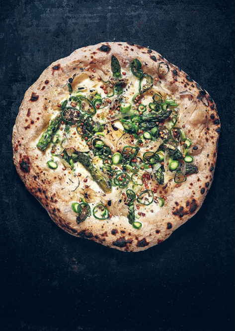 Pizza with asparagus, pimientos de Padrón, roasted buckwheat and dill oil