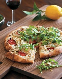 Pizza with caramelized fennel, arugula, and lemon