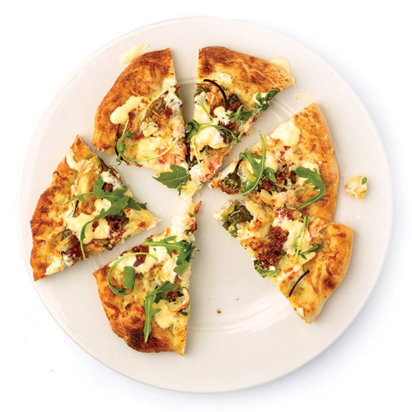 Pizza with snow crab, ricotta, shishito peppers, and wasabi