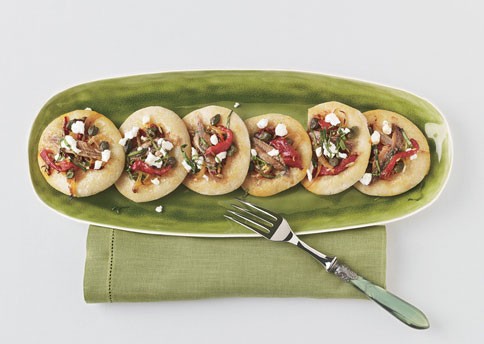 Pizzettas with red peppers, onions, and anchovies