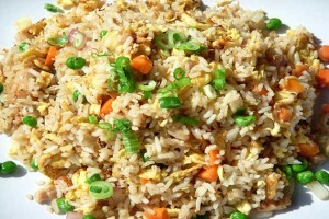 Plain fried rice, egg, and peas
