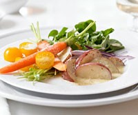 Plated red potato salad with mustard dressing