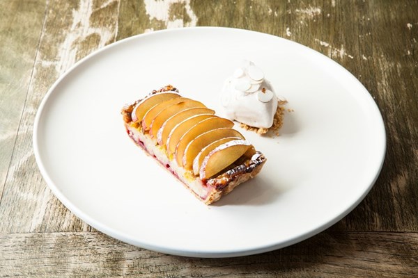 Plum and hazelnut tart with meadowsweet ice cream