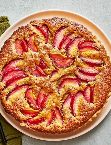 Plum and pistachio frangipane tart