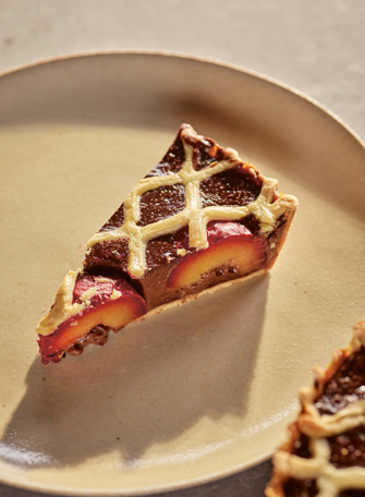 Plum, chocolate and orange lattice tart