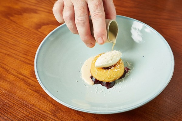 Poached cherries with frangipane, clotted cream ice cream and almond soup