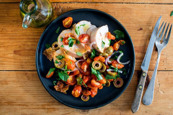 Poached chicken breasts with parsley-onion salad