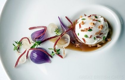Poached duck egg with roasted onion consommé, lemon thyme and smoked duck