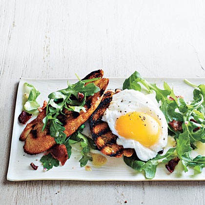 Poached egg and arugula salad bruschetta