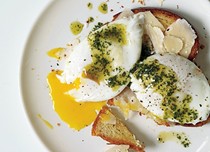 Poached eggs and Parmesan cheese over toasted brioche with pistou