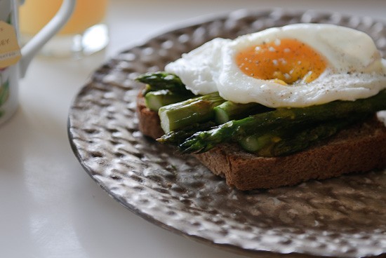 Poached eggs and roasted asparagus on honey whole-wheat toast