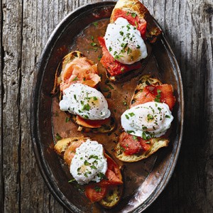 Poached eggs and smoked salmon on tapenade mayonnaise-smeared bread