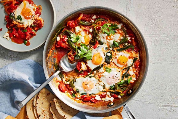 Poached eggs in tomato-poblano rajas sauce (Huevos rabo de mestiza)