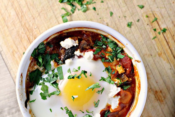 Poached eggs in tomato sauce with chickpeas, feta and Swiss chard