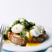 Poached eggs on toast with flavoured butter