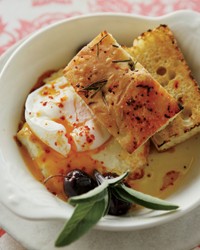 Poached eggs with baked feta and olives