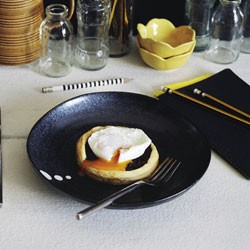 Poached eggs with caramelised red onion tartlets