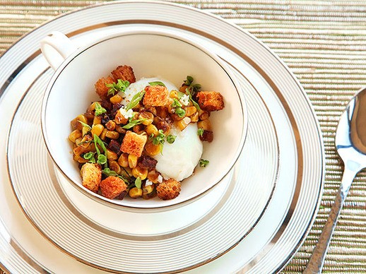 Poached eggs with corn, chorizo, basil, and brioche croutons