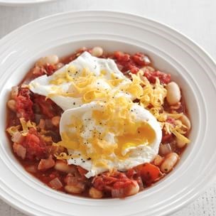 Poached eggs with white bean-tomato ragout