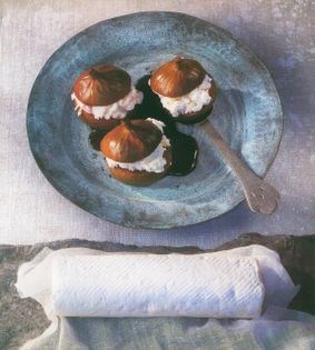 Poached figs stuffed with Sainte-Maure cheese in Merlot wine syrup