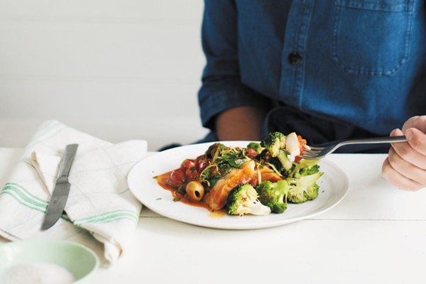 Poached fish with spinach in a chilli-tomato sauce
