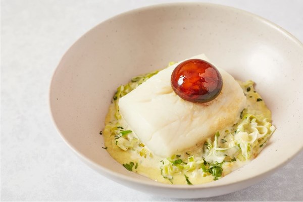 Poached haddock with soy-cured egg yolk and creamy curried leeks [Richard Bainbridge]