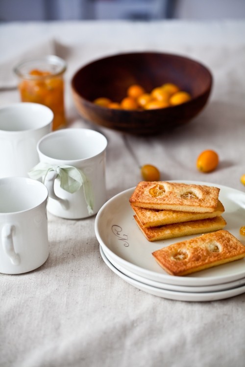 Poached kumquats and almond cakes