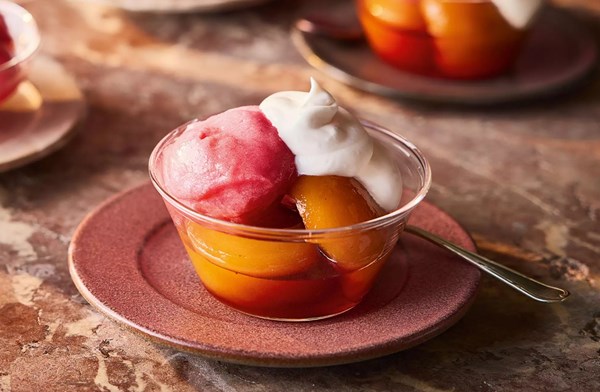 Poached peaches with vanilla cream & raspberry sorbet