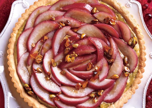 Poached pear tart with caramelized pistachios