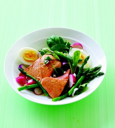 Poached salmon with asparagus, herbs, and baby greens