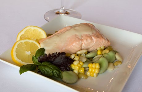Poached salmon with basil butter and succotash