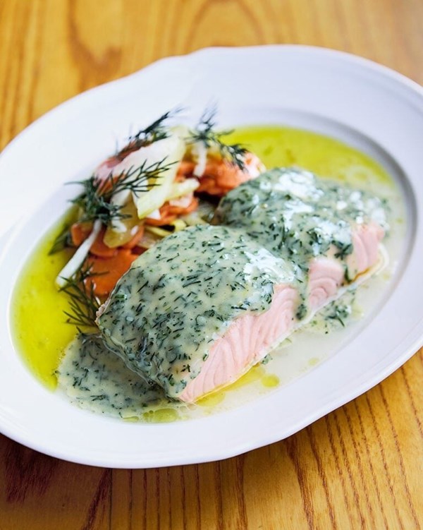 Poached salmon with spring vegetables and a herb dressing 