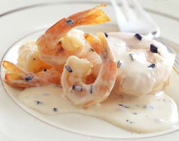 Poached salmon with truffles and shrimp in cream sauce