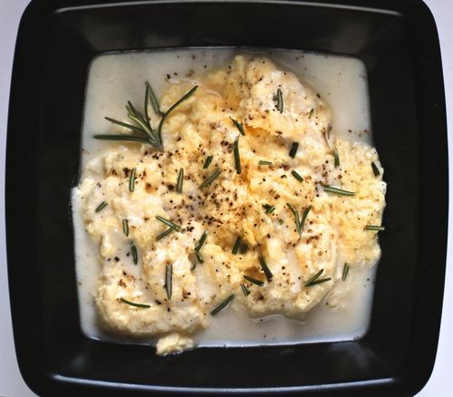 Poached scrambled eggs with goat cheese sauce