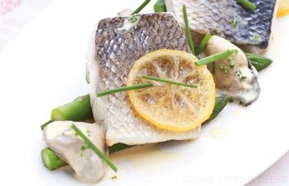 Poached sea bass, confit lemon butter, asparagus and Royal Bay oysters