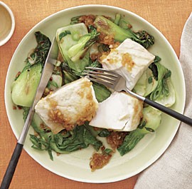 Poached striped bass with bok choy and broken ginger dressing