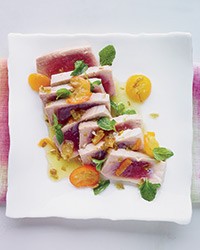 Poached tuna with kumquats and jalapeño