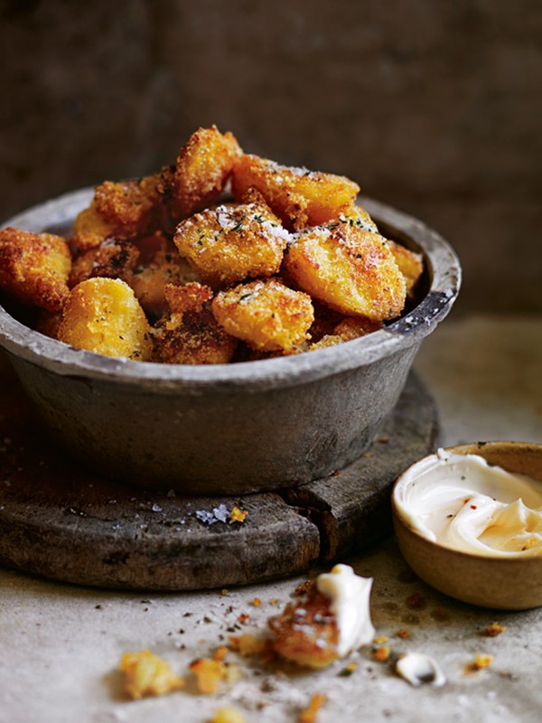 Polenta and Parmesan-crumbed potatoes with rosemary salt