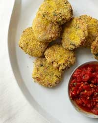 Polenta-crusted fish cakes with spicy tomato sauce