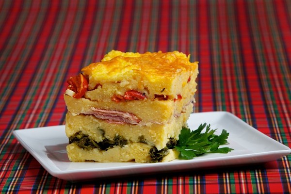 Polenta gratin with ham, greens and smoked cheddar