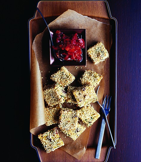 Polenta, olive and sesame cubes with caramelised peppers