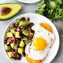 Polenta rounds with fried eggs and avocado bean salsa