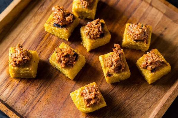 Polenta squares with sun-dried tomato and walnut tapenade