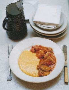 Polenta with chicken and sausage stew (Polenta concia con ragu di pollo e salsiccia)