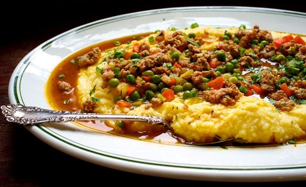 Polenta with peas and pork sausage