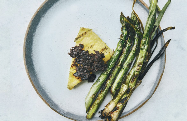 Polenta with tapenade, asparagus, and scallions