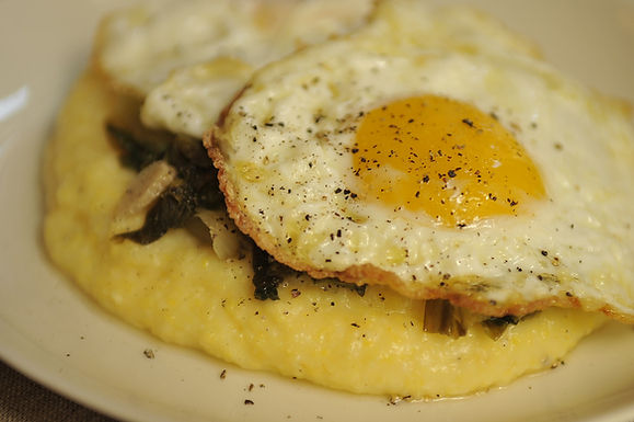 Polenta with wilted escarole and olive oil fried eggs